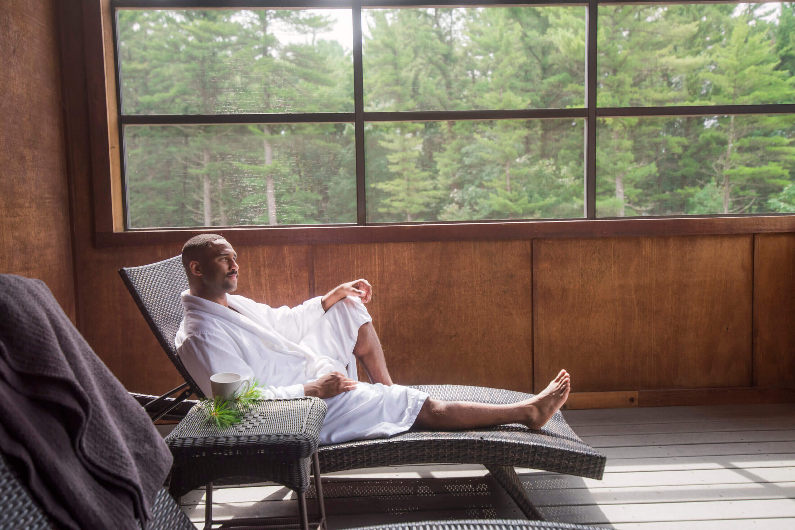male enjoying patio in suite